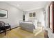 Bright bedroom featuring modern décor, hardwood floors, and white walls at 1260 Brook Forest Ne Dr, Atlanta, GA 30324