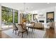 Open dining room area with large windows and view of the pool at 1260 Brook Forest Ne Dr, Atlanta, GA 30324