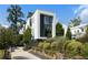Landscaped front yard and modern architecture enhance the curb appeal of this home at 1260 Brook Forest Ne Dr, Atlanta, GA 30324