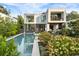 Modern home exterior with a pool, manicured garden, and outdoor living space at 1260 Brook Forest Ne Dr, Atlanta, GA 30324