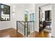 Hallway with wooden floors and railing plus an office visible at 1260 Brook Forest Ne Dr, Atlanta, GA 30324