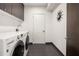 Clean and modern laundry room featuring a washer, dryer, and storage cabinets at 1260 Brook Forest Ne Dr, Atlanta, GA 30324