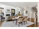 Open living and dining area with a modern chandelier and fireplace focal point at 1260 Brook Forest Ne Dr, Atlanta, GA 30324