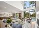 Open concept living room with seamless flow to outdoor pool area, showcasing natural light at 1260 Brook Forest Ne Dr, Atlanta, GA 30324