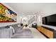 Inviting living room showcasing a comfortable gray sofa, modern art, and a cozy armchair at 1260 Brook Forest Ne Dr, Atlanta, GA 30324