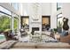 Bright living room featuring high ceilings, floor to ceiling windows and stylish decor at 1260 Brook Forest Ne Dr, Atlanta, GA 30324