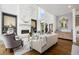 Bright living room boasts high ceilings, fireplace, and wet bar area at 1260 Brook Forest Ne Dr, Atlanta, GA 30324