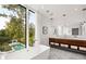 Bright main bathroom with marble floors, dual sinks, modern fixtures, and a soaking tub at 1260 Brook Forest Ne Dr, Atlanta, GA 30324