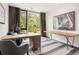 Bright office with large window, stylish desks, patterned rug, and modern artwork at 1260 Brook Forest Ne Dr, Atlanta, GA 30324