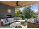 Cozy covered outdoor living space with brick fireplace and comfortable seating at 1260 Brook Forest Ne Dr, Atlanta, GA 30324