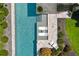 Aerial view of the backyard pool showcasing the in-pool loungers, patio area, and beautifully manicured landscaping at 1260 Brook Forest Ne Dr, Atlanta, GA 30324