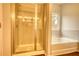 Bathroom featuring glass shower enclosure and large soaking tub with window view at 700 Park Place Way, Social Circle, GA 30025