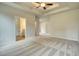 Spacious bedroom with recessed lighting, neutral carpet, and ensuite bathroom view to the left at 700 Park Place Way, Social Circle, GA 30025