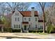 Lovely home features a red tile roof, landscaped yard, and an inviting entrance at 1122 Springdale Ne Rd, Atlanta, GA 30306