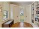 Hallway with built-in bench, bookcase, and access to a bright WC at 1122 Springdale Ne Rd, Atlanta, GA 30306