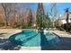 Beautiful kidney-shaped pool with attached jacuzzi and backyard lounge area at 1122 Springdale Ne Rd, Atlanta, GA 30306