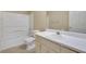 Bathroom with a combination tub and shower, updated vanity, and good lighting at 1150 Strath Clyde Way, Mcdonough, GA 30253