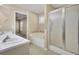 Bathroom with a tiled floor, vanity with double sinks, and a glass-enclosed shower at 1150 Strath Clyde Way, Mcdonough, GA 30253