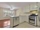 Modern kitchen featuring stainless steel appliances and a view of the breakfast nook at 1150 Strath Clyde Way, Mcdonough, GA 30253