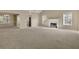 Bright and airy living room featuring a fireplace and seamless flow to the dining area at 1150 Strath Clyde Way, Mcdonough, GA 30253