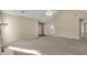 Spacious living room showcasing high ceilings, a cozy fireplace, and seamless flow to the dining area at 1150 Strath Clyde Way, Mcdonough, GA 30253