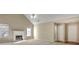 Comfortable living room featuring a fireplace, vaulted ceiling, and abundant natural light at 1150 Strath Clyde Way, Mcdonough, GA 30253