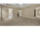 Expansive carpeted main bedroom with tray ceiling features a walk-in closet and en-suite bathroom at 1150 Strath Clyde Way, Mcdonough, GA 30253