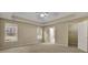 Spacious main bedroom featuring a tray ceiling, neutral color palette and windows that provide ample natural light at 1150 Strath Clyde Way, Mcdonough, GA 30253