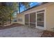 A screened-in porch leading to a patio, ideal for outdoor entertaining at 1150 Strath Clyde Way, Mcdonough, GA 30253
