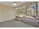 Relaxing screened porch with a view of the wooded backyard at 1150 Strath Clyde Way, Mcdonough, GA 30253