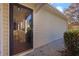 Side entrance featuring a glass storm door, leading to a welcoming porch at 1150 Strath Clyde Way, Mcdonough, GA 30253