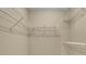 Organized walk-in closet features wire shelving for ample storage solutions at 1150 Strath Clyde Way, Mcdonough, GA 30253