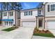 Charming new construction townhomes feature a two-car garage, and well-maintained landscaping at 308 Shine Dr, Stockbridge, GA 30281