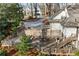 Aerial view of a home featuring a backyard with multi-level deck and manicured landscaping surrounded by trees at 501 Brook Hollow Se Cir, Marietta, GA 30067