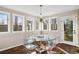 Bright dining area with modern transparent table, hardwood flooring, and lots of natural light at 501 Brook Hollow Se Cir, Marietta, GA 30067