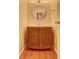 Cozy half bathroom with a decorative mirror, wooden vanity, and tiled floor at 1225 Sand Knoll Sw Run, Lilburn, GA 30047