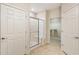 Bathroom with a glass shower, a closet and ceramic floors at 1350 Bluestone Dr, Cumming, GA 30041