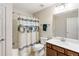 Bathroom with shower-tub combo, vanity with drawers, and a nautical themed shower curtain at 1350 Bluestone Dr, Cumming, GA 30041