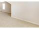 A bedroom is shown with carpeted floors and one window at 1350 Bluestone Dr, Cumming, GA 30041