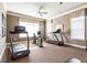 Spacious fitness center featuring a treadmill, stationary bike, and natural light at 1350 Bluestone Dr, Cumming, GA 30041