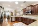 Stylish kitchen with granite countertops, stainless steel appliances, and hardwood floors at 1350 Bluestone Dr, Cumming, GA 30041