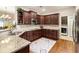 Spacious kitchen featuring granite counters, stainless appliances, and wooden cabinets at 1350 Bluestone Dr, Cumming, GA 30041