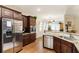 Well-equipped kitchen with granite countertops, stainless steel appliances, and ample storage at 1350 Bluestone Dr, Cumming, GA 30041