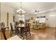 Open-concept living and dining area featuring hardwood floors and ample natural light at 1350 Bluestone Dr, Cumming, GA 30041