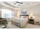 Relaxing bedroom featuring tray ceiling, bright windows, and neutral decor at 1350 Bluestone Dr, Cumming, GA 30041