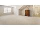 Large room with beige carpet, a window, and dresser at 1350 Bluestone Dr, Cumming, GA 30041