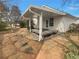 Home's backyard boasts a covered seating area with easy access to the residence at 207 Autumn Lake Way, Mcdonough, GA 30253