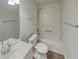 A clean bathroom featuring a bathtub, white sink, and neutral walls at 207 Autumn Lake Way, Mcdonough, GA 30253