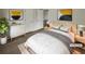 Bright staged bedroom with modern décor, natural light, and new flooring at 207 Autumn Lake Way, Mcdonough, GA 30253