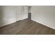 A spacious bedroom featuring modern floors, neutral walls, and ample closet space at 207 Autumn Lake Way, Mcdonough, GA 30253